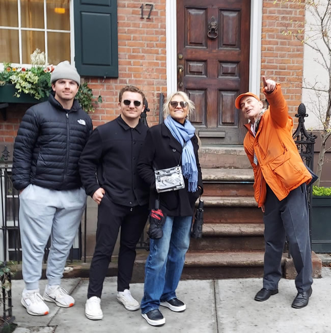 Jared with an individual/group tour pointing out interesting facts about Greenwich Village